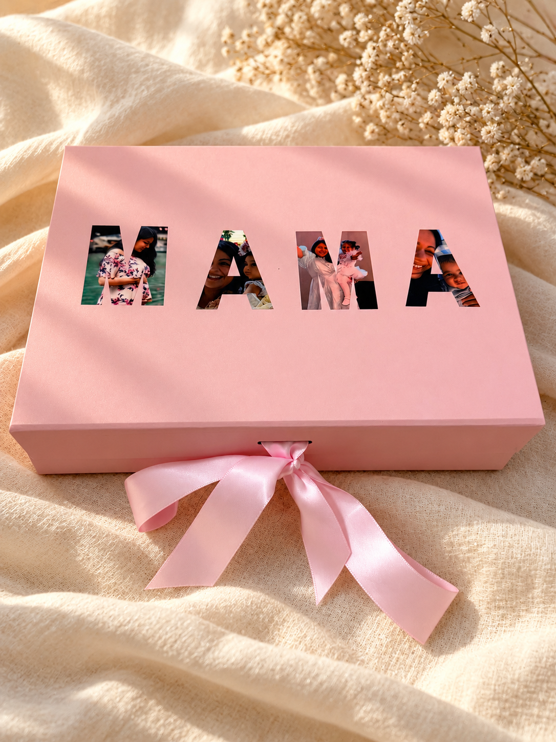 Pink Mamaki memory box with photo-filled MAMA lettering and a satin ribbon bow